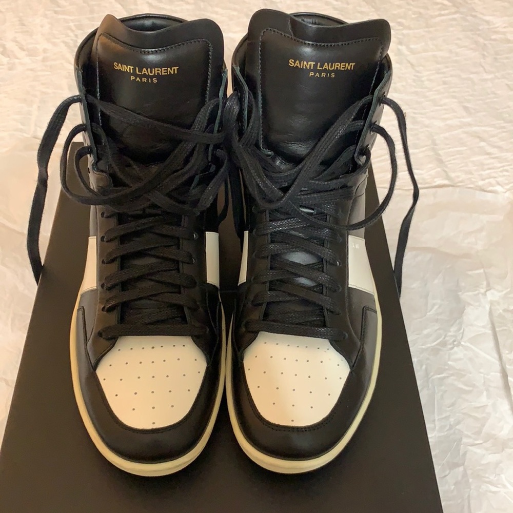 These high top Saint Laurent sneakers are in good condition. Still in style!
